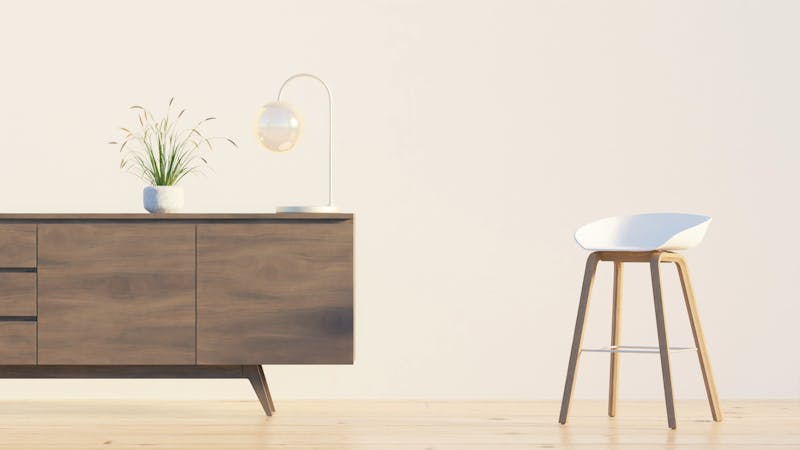 Aparador de madera con silla blanca